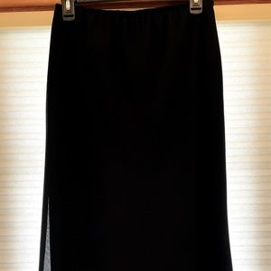 Long black skirt with ruffle hemline